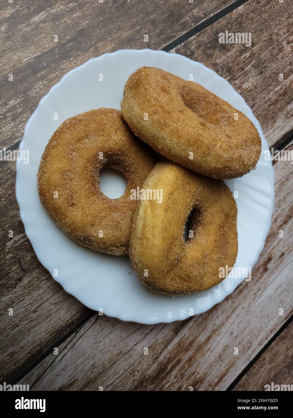 Cinnamon donut filled with apricot jam Stock Photo Alamy