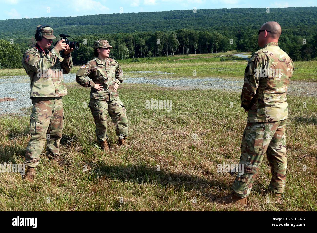 U.S. Army Pfc. David Thomson and Cpl Vail Forbeck, mass communication specialists with the 109th Mobile Public Affairs Detachment, 213th Regional Support Group, Pennsylvania Army National Guard, conduct a video interview during a training exercise during Annual Training at Ft. Indiantown Gap, PA. July 20, 2022. Public Affairs Soldiers are a vital flexible asset and excel at telling the Army story. Stock Photo