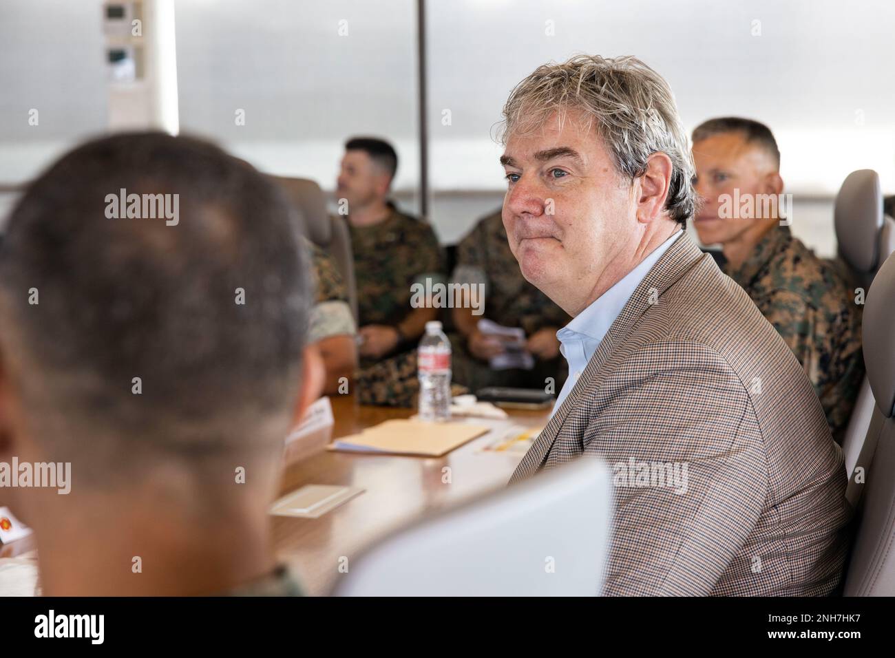 The Honorable John P. Coffey, head of the office of the General Counsel, Department of the Navy, attends a brief during a visit to MCBH, July 21, 2022. The purpose of the visit was to inform the Mr. Coffey on the base’s progression toward Force Design 2030. Stock Photo