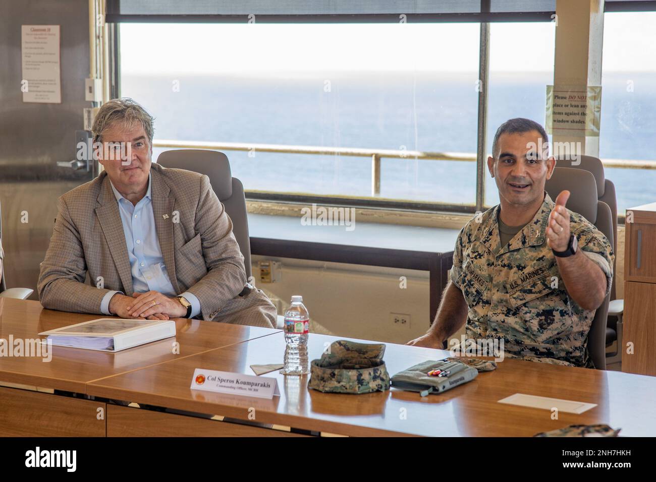 The Honorable John P. Coffey, left, head of the office of the General Counsel, Department of the Navy, and U.S. Marine Corps Col. Speros Koumparakis, commanding officer, Marine Corps Base Hawaii, participate in a brief during a visit to MCBH, July 21, 2022. The purpose of the visit was to inform Mr. Coffey on the base’s progression toward Force Design 2030. Stock Photo