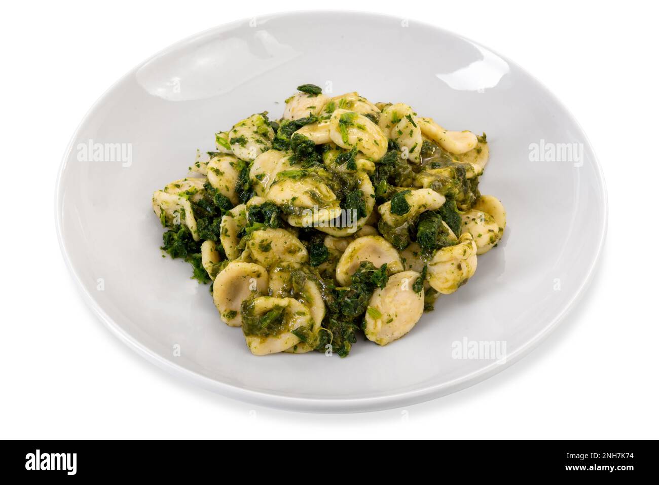 Orecchiette pasta with turnip tops, typical Italian recipe from Puglia region in white plate
