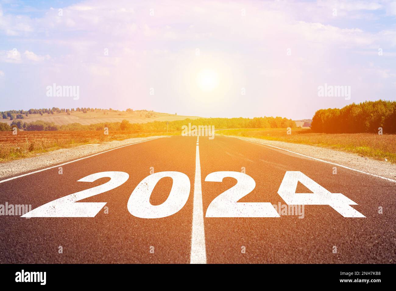 2024 written on highway road in the middle of empty asphalt road and