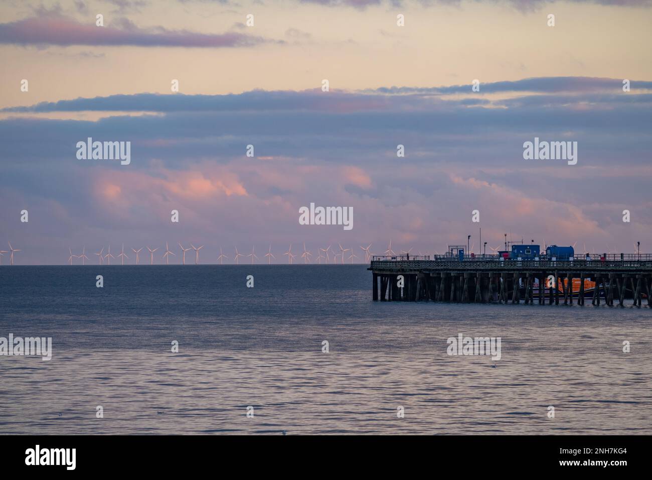 The pier at Walton on the Naze with windsurf in the distance. Stock Photo