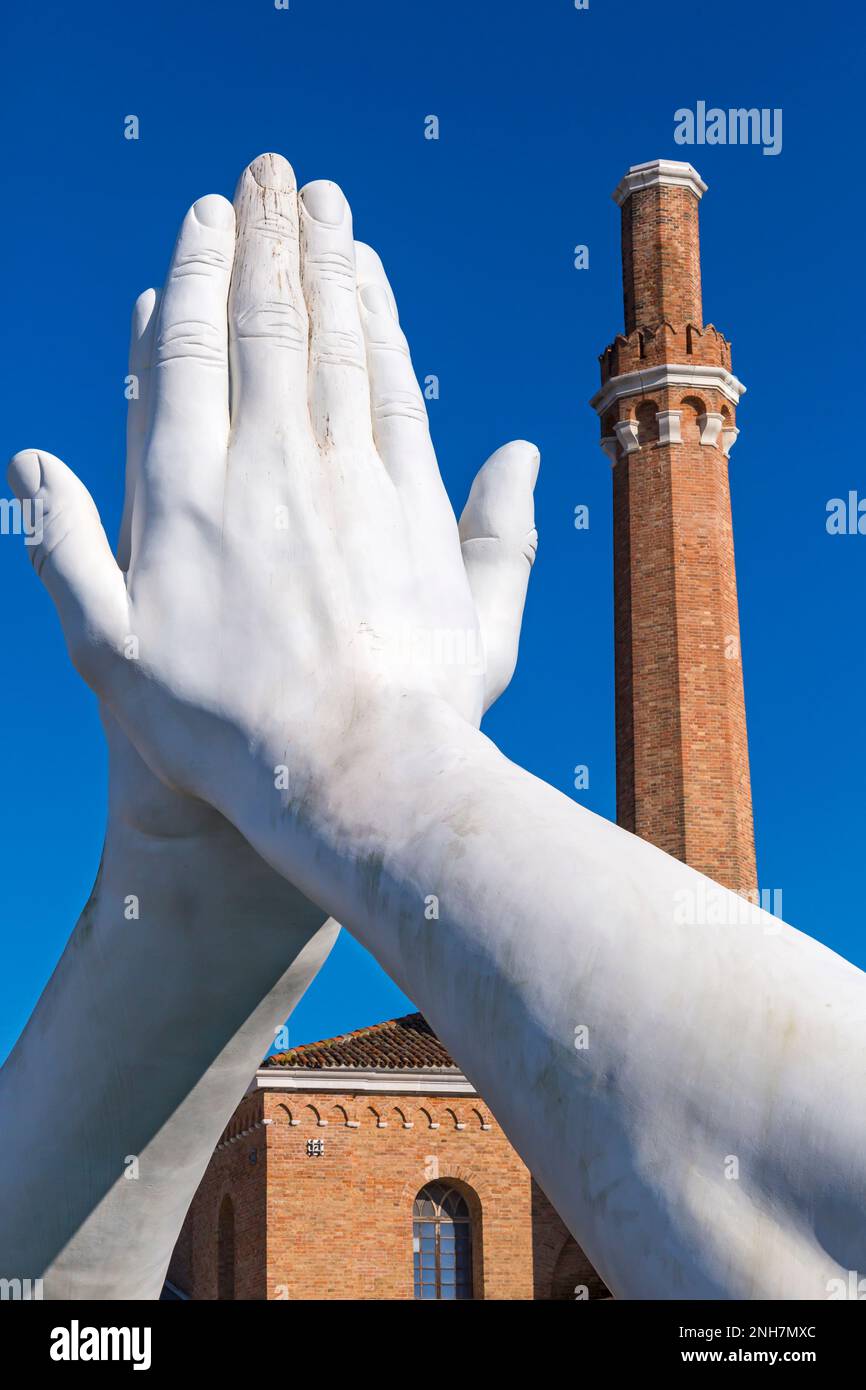 Building Bridges sculpture by artist Lorenzo Quinn depicting 6 pairs of monumental hands, wisdom hope love help faith friendship at Venice, Italy Stock Photo