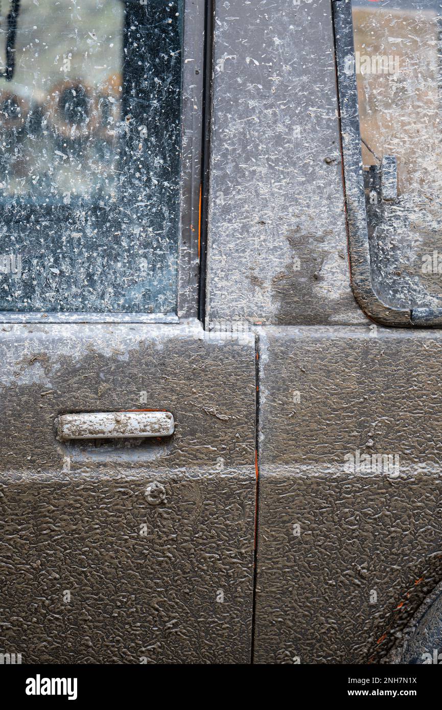 Mad splattered 4x4 SUV. Dirty car side. Splash and texture of mud on a ...