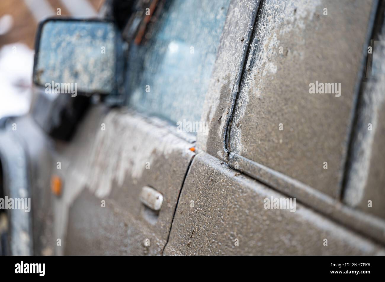 Mad splattered 4x4 SUV. Dirty car side. Splash and texture of mud on a ...