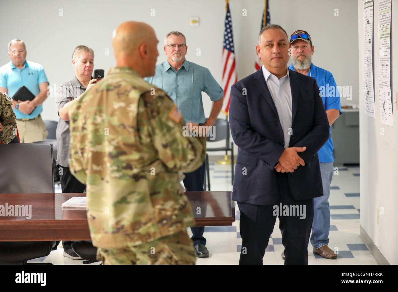 Honorable Gilbert Cisneros Jr., Under Secretary of Defense for Personnel and Readiness, second from right, listens as Col. James Brady, garrison commander, Fort Bliss, Texas, discusses the accomplishments of award recipients during an award ceremony at Fort Bliss, Texas, July 21, 2022. provides an overview of Fort Bliss and the Mobilization Force Generation Installation (MFGI). Fort Bliss is the Army’s largest of the U.S. Army’s two MFGIs which support unit and individual mobilization and demobilization missions. Stock Photo