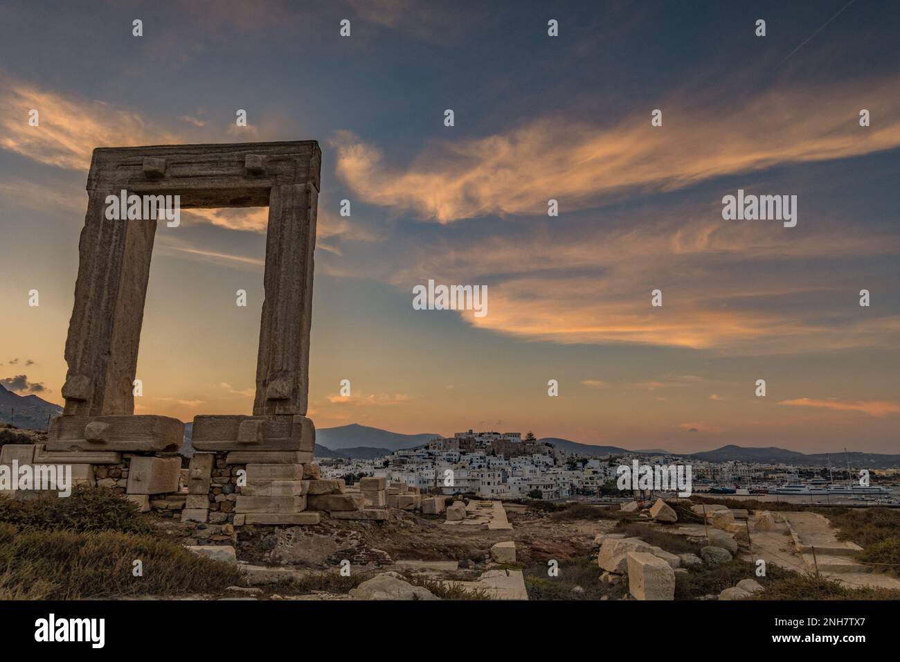 Panoramic view on Naxos town from the Portara at dusk Stock Photo