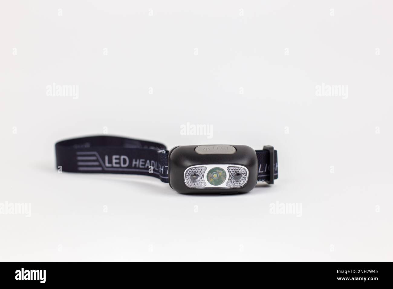 a flashlight on the head for illumination on a white background object Stock Photo