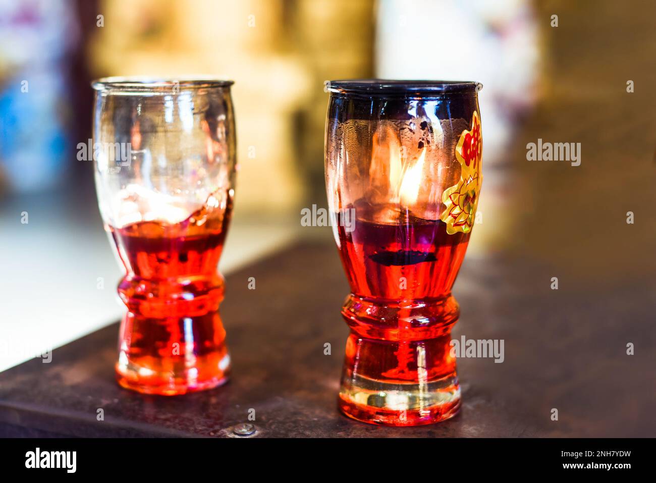 Religious oil for senko candles in Vietnamese Buddhist temple Stock