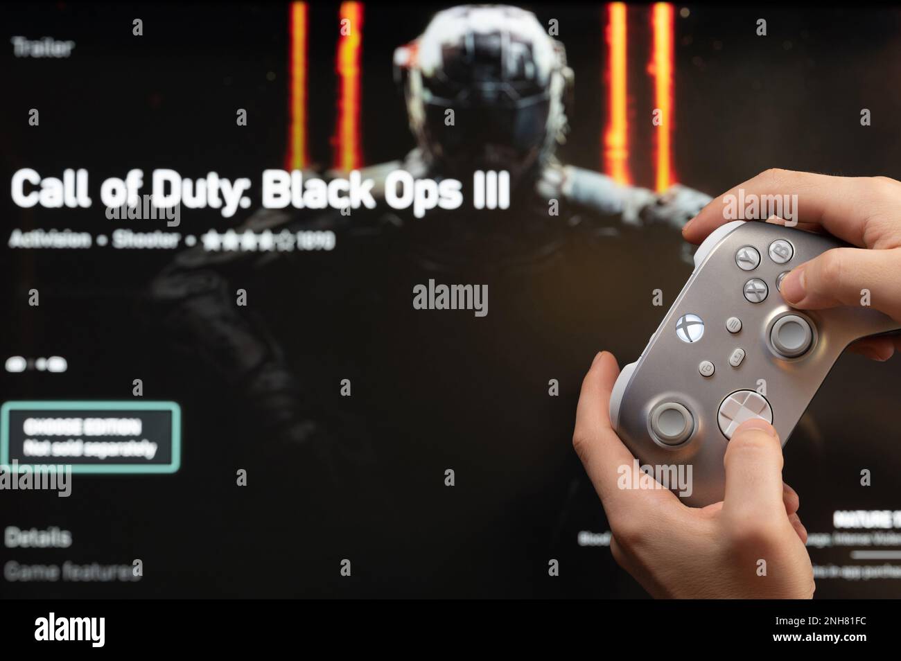 New york, USA - February 20, 2023: Gamer start new Call of Duty  Game on xbox console with joystick in hand Stock Photo
