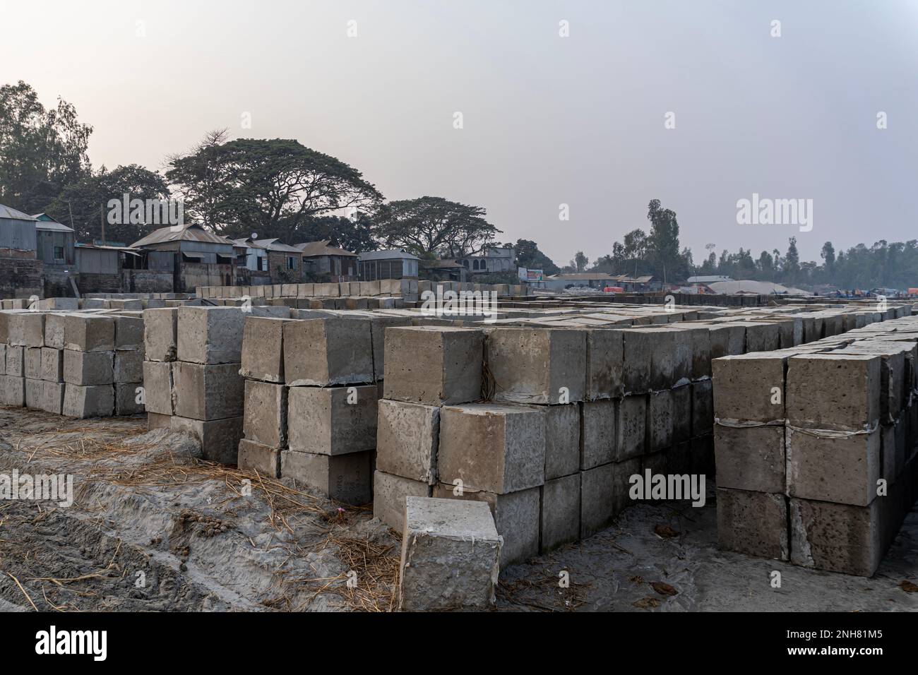 A pile of four square cinder blocks in a row. Rock bolder. Concrete