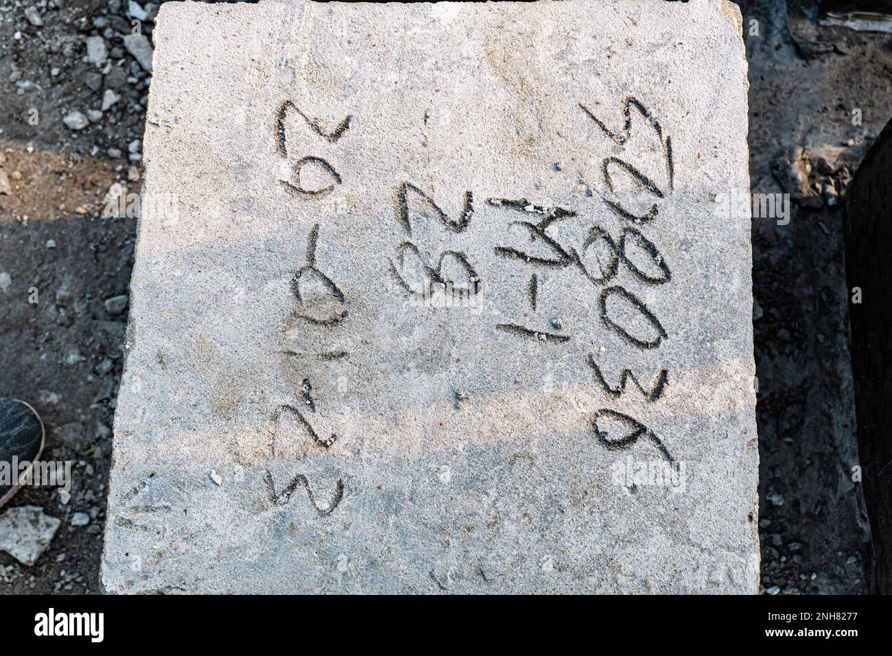 Four square cinder blocks in a row. Rock bolder. Concrete cube over ...