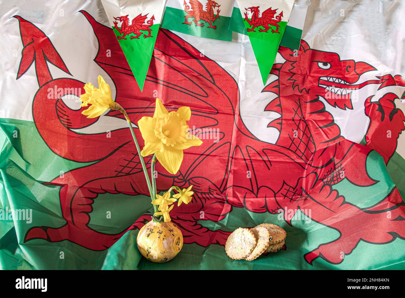 Celebrating St davids day Welsh flag Daffodils welsh cakes vintage style Stock Photo