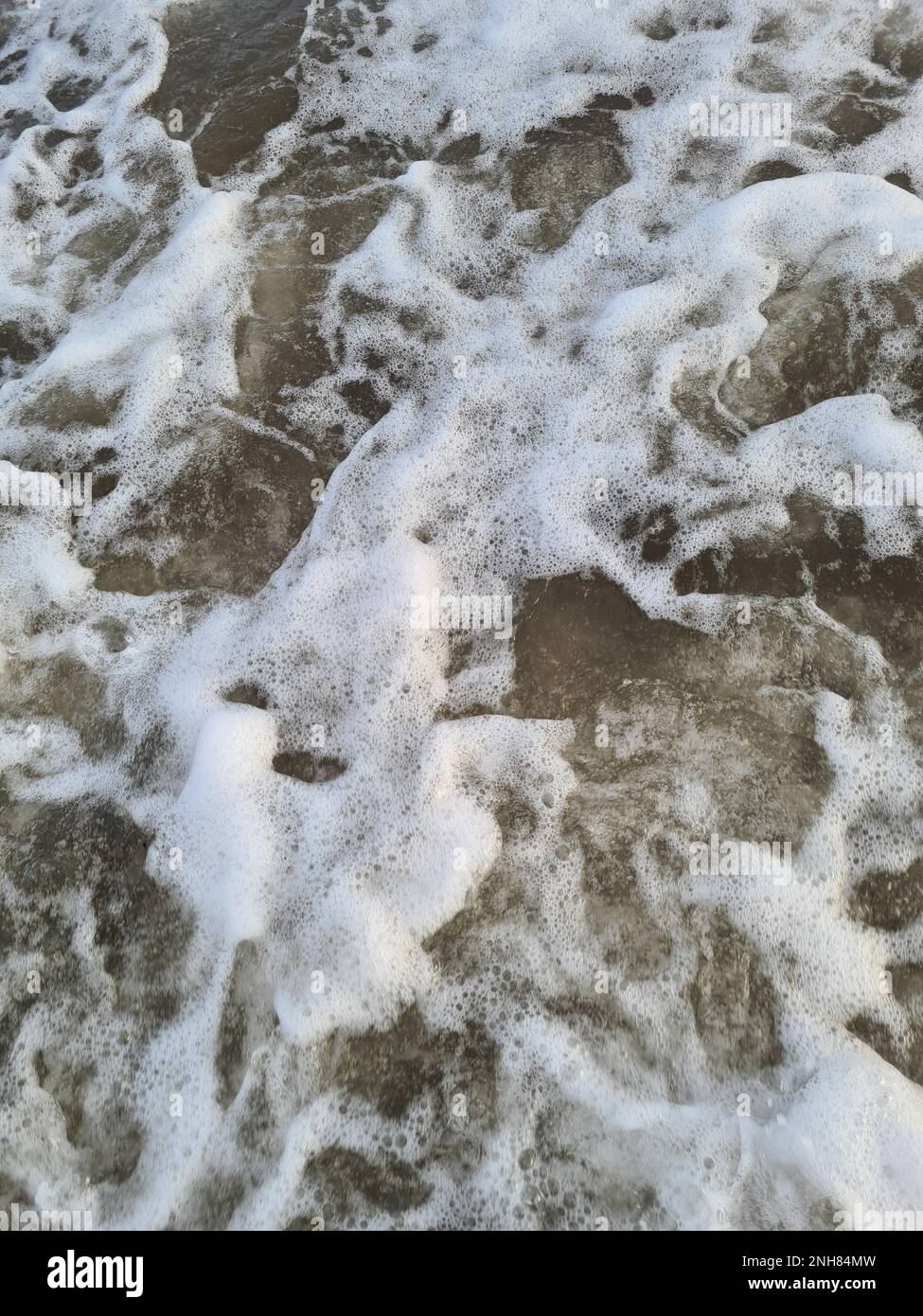 White foam on sea water texture macro close up view Stock Photo Alamy