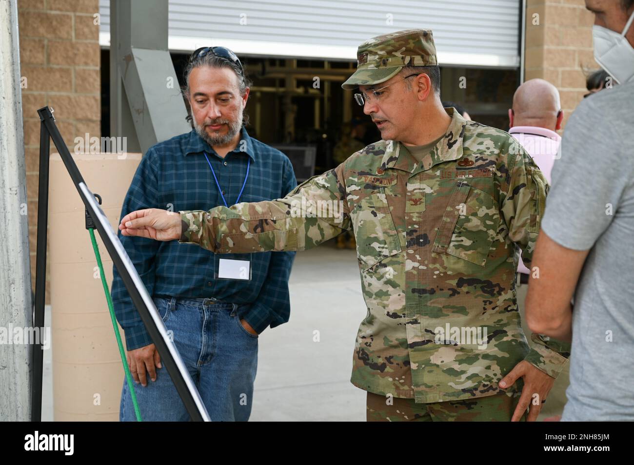 Col. Jason Vattioni, 377th Air Base Wing commander, discusses the Bulk Fuels Facility Cleanup Project with Ben Mouyyad, U.S. Army Corps of Engineers technical lead, at the Groundwater Treatment Facility at Kirtland Air Force Base, NM, July 21, 2022. The Groundwater Treatment Facility cleans ethylene dibromide (EDB) from the drinking water supply. Stock Photo