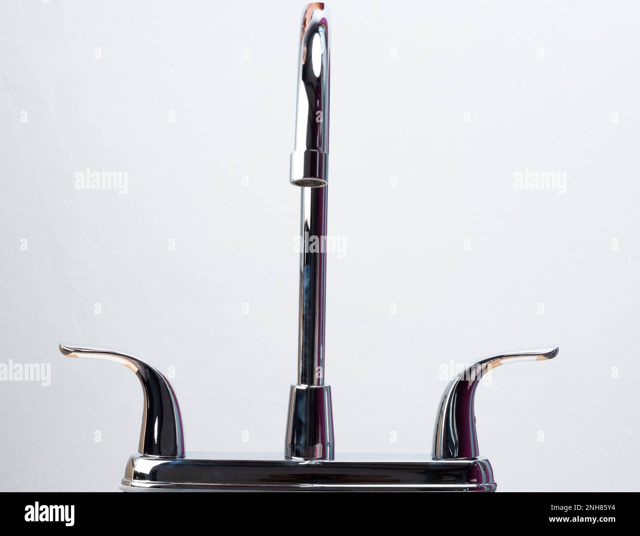Chrome shiny kitchen faucet isolated on white studio background Stock