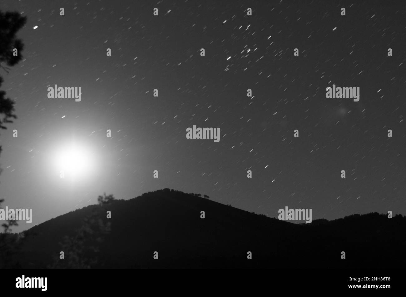Starry sky at night in mountains top. Stock Photo