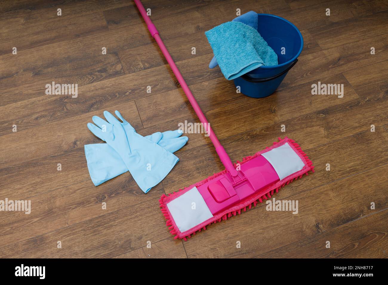 Mop, gloves and bucket on the wash floor Stock Photo Alamy