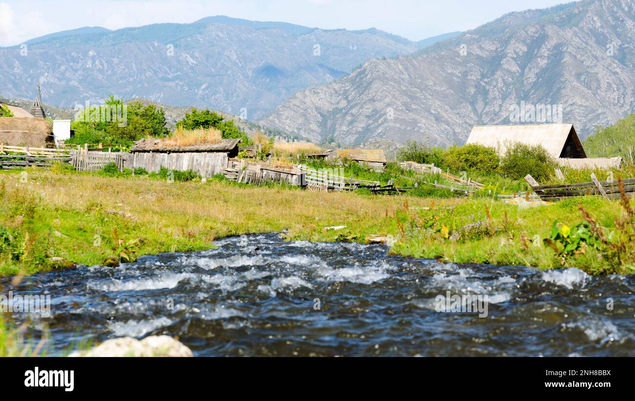 Male exercisers on the bar among the mountains Altai. Stock Photo