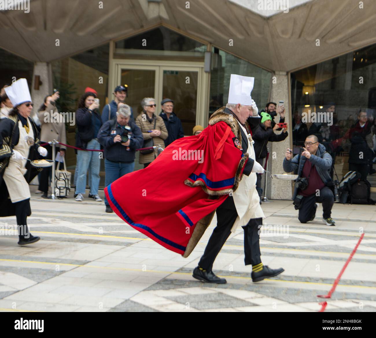London, UK. 21st Feb, 2023. Shrove Tuesday Livery companies pancake race, Guildhall London UK