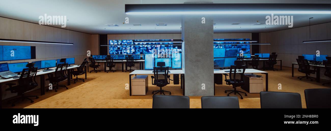 Security Room Dim Empty interior of big modern security system control room, workstation ...