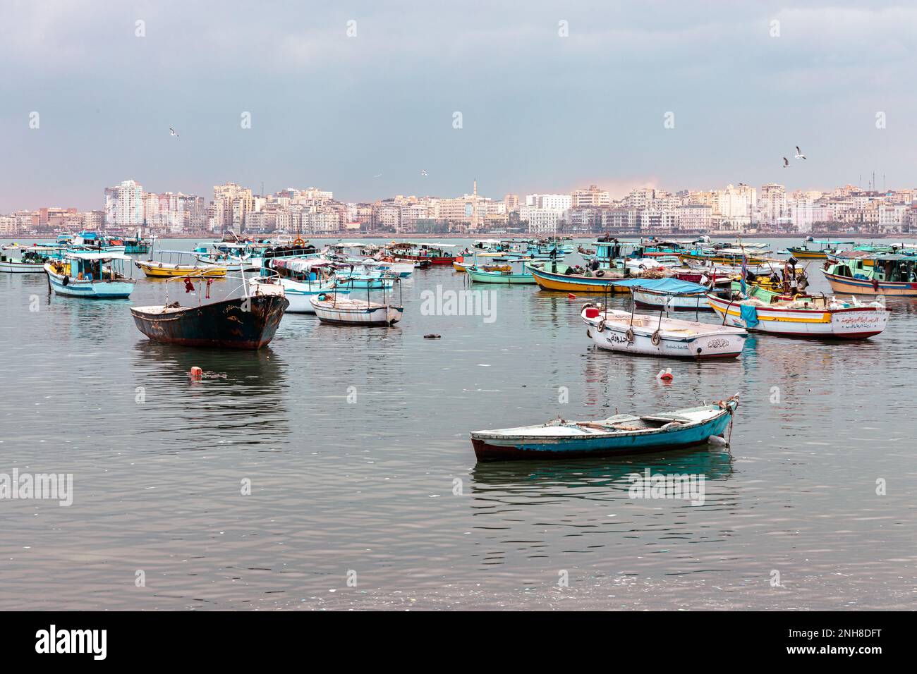 Harbor of Fishing Boats Floating on Blue Sea Water, Alexandria, Egypt. Africa. Stock Photo