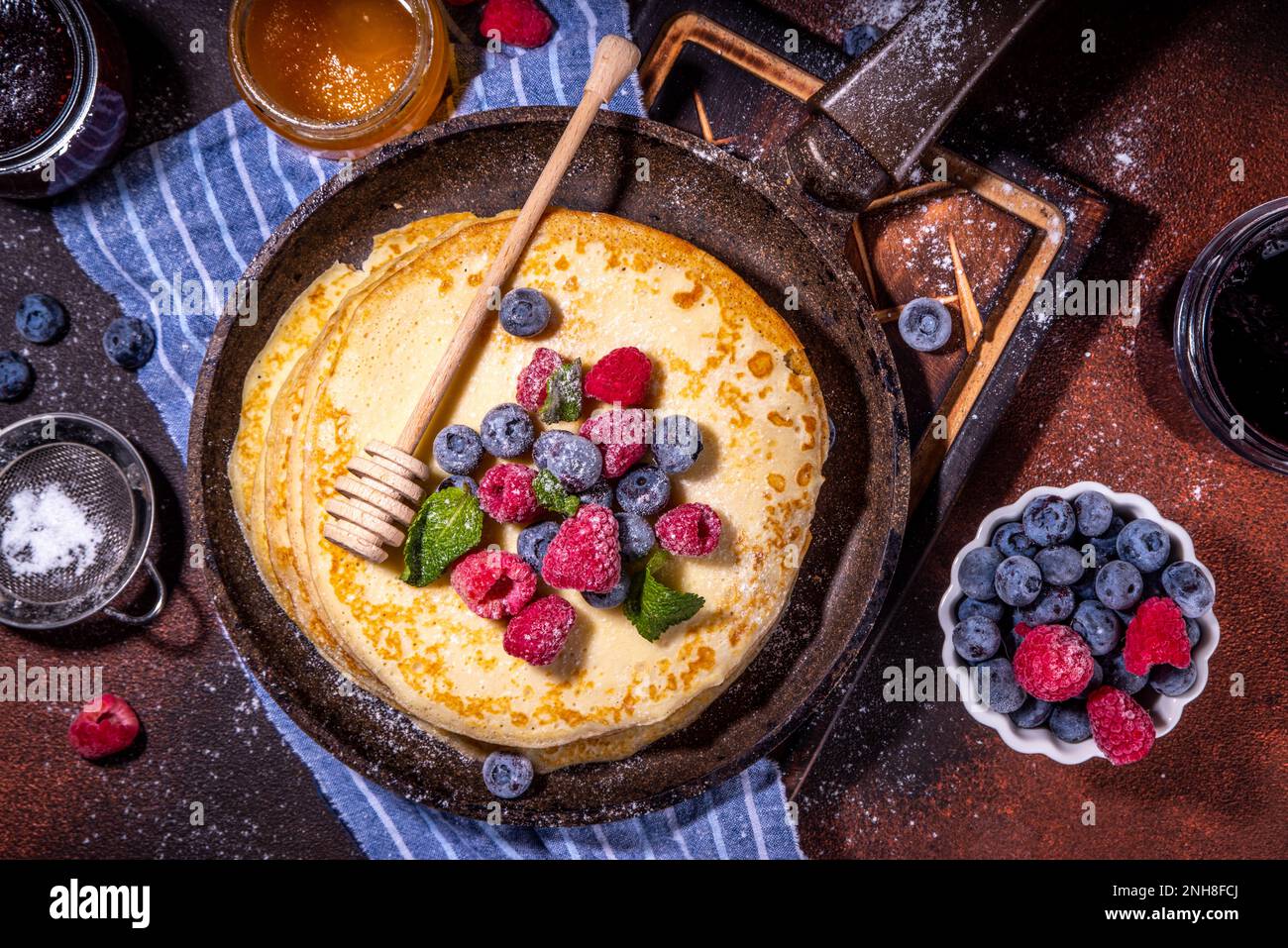 Homemade french tiny pancakes, battercakes with berry. Stack of freshly ...