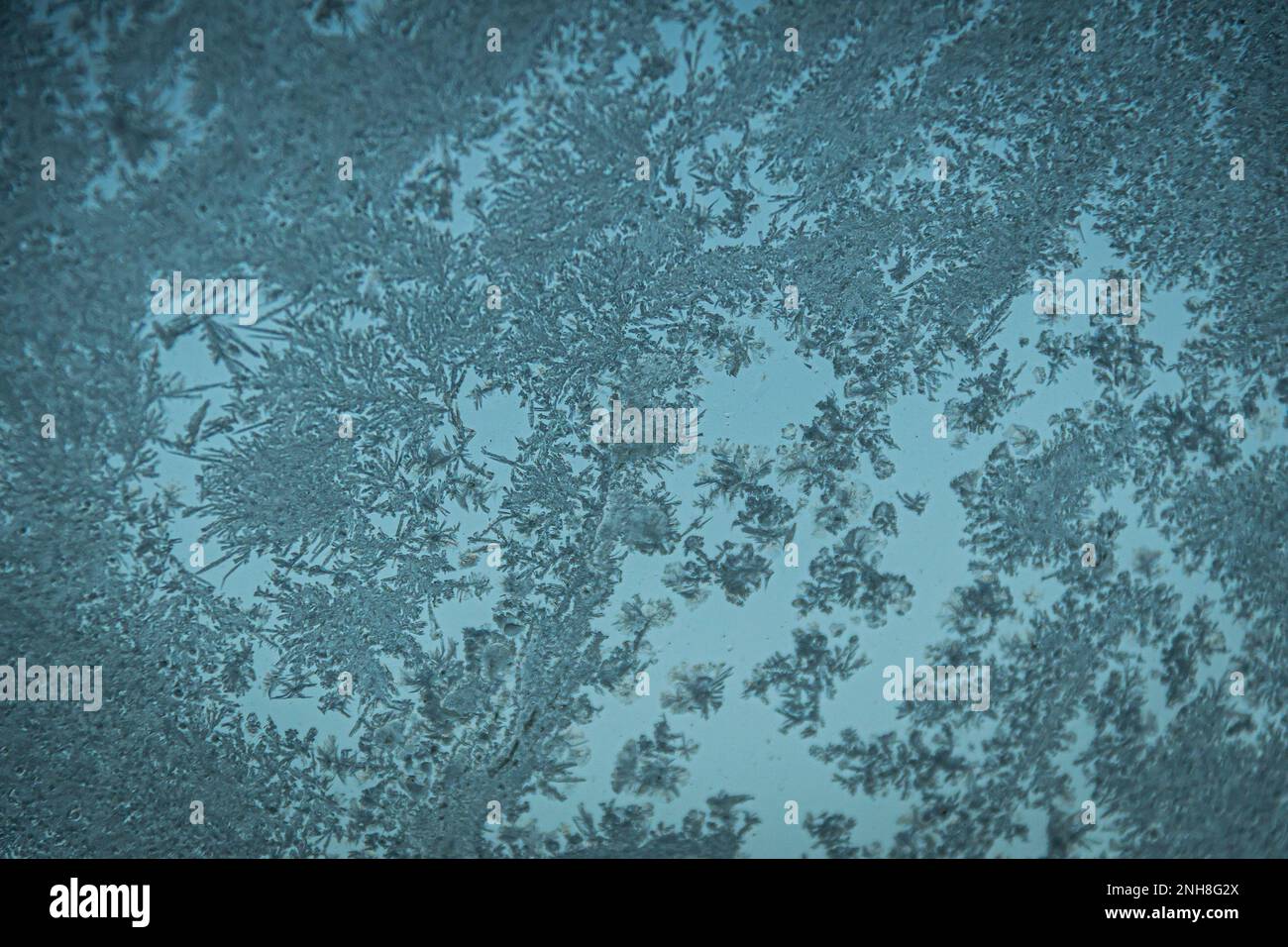 Frost ice crystals on the surface of glass in blue tones Stock Photo ...