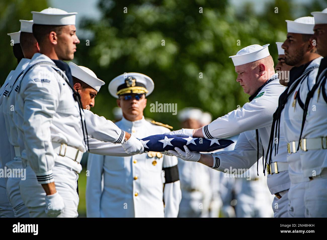 Service members from the U.S. Navy Ceremonial Guard, the U.S. Navy Ceremonial Band, and the 3d U.S. Infantry Regiment (the Old Guard) Caisson Platoon conduct military funeral honors with funeral escort for U.S. Navy Chief Pharmacist’s Mate James T. Cheshire in Section 62 of Arlington National Cemetery, Arlington, Va., July 22, 2022. Cheshire died on Dec. 7, 1941 when the battleship he was assigned to, the USS Oklahoma at Ford Island, Pearl Harbor, was attacked by Japanese aircraft.    From the Defense POW/MIA Account Agency (DPAA) press release:    The USS Oklahoma sustained multiple torpedo h Stock Photo