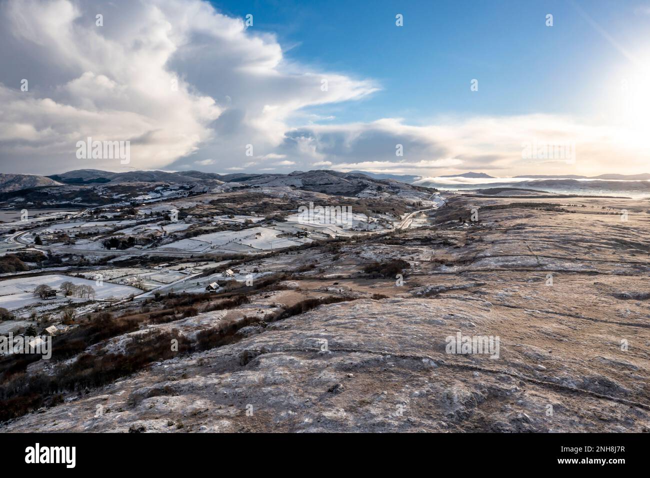 Snow covered Maas seen from Bonny Glen Woods by Portnoo in County Donegal, Ireland Stock Photo