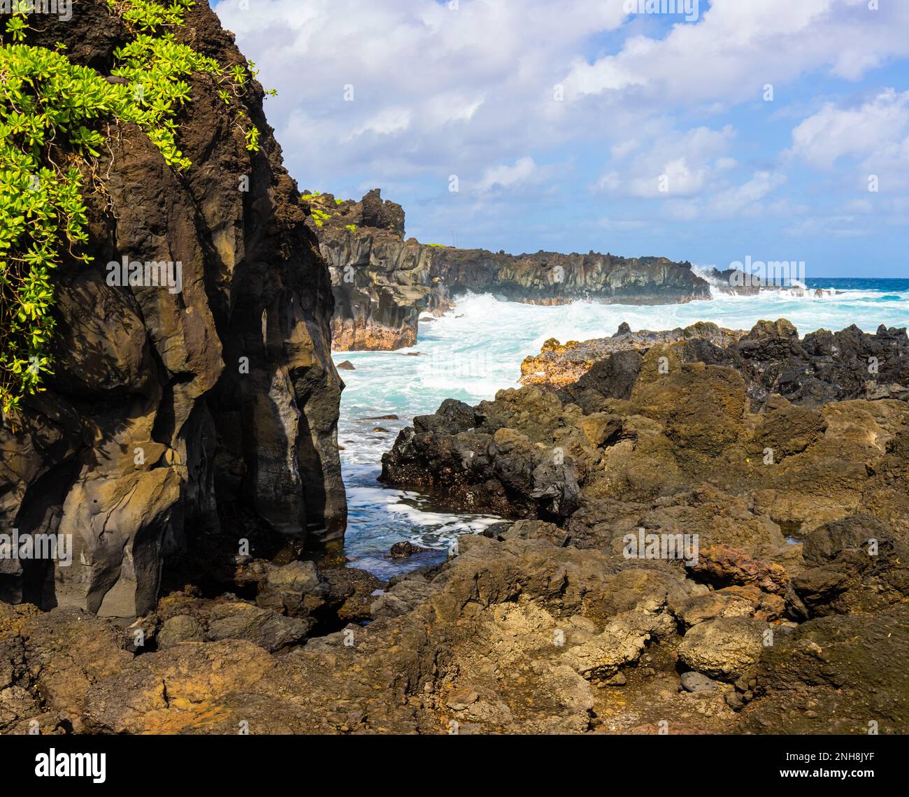 Waves Crash Against Rugged Lava Coastline Near Kauiau Point, Waianapanapa State Park, Maui, Hawaii, USA Stock Photo