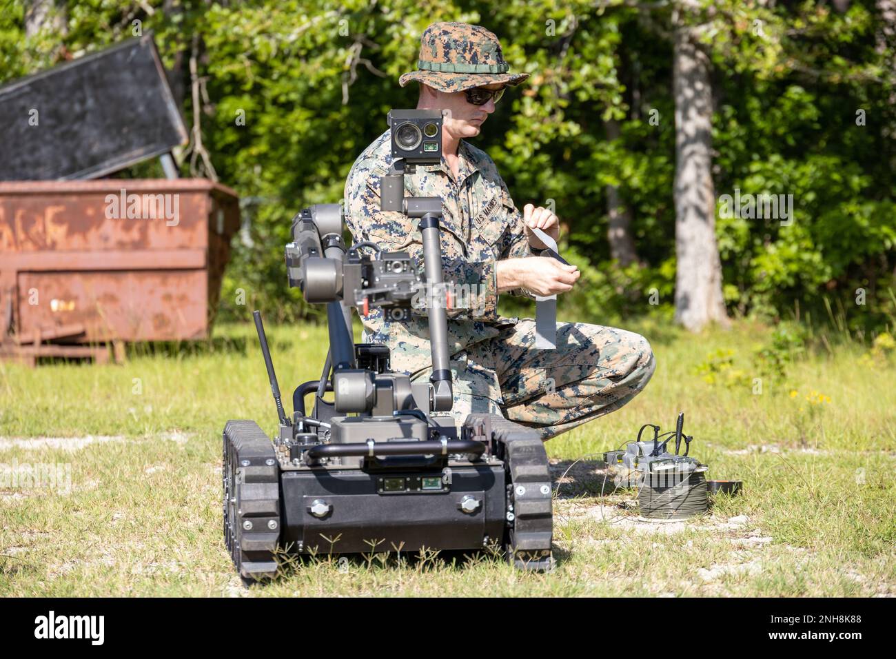 Remote Explosive Charging U.S. Marine Corps Staff Sgt. Robert Garrison, an explosive ordnance ...