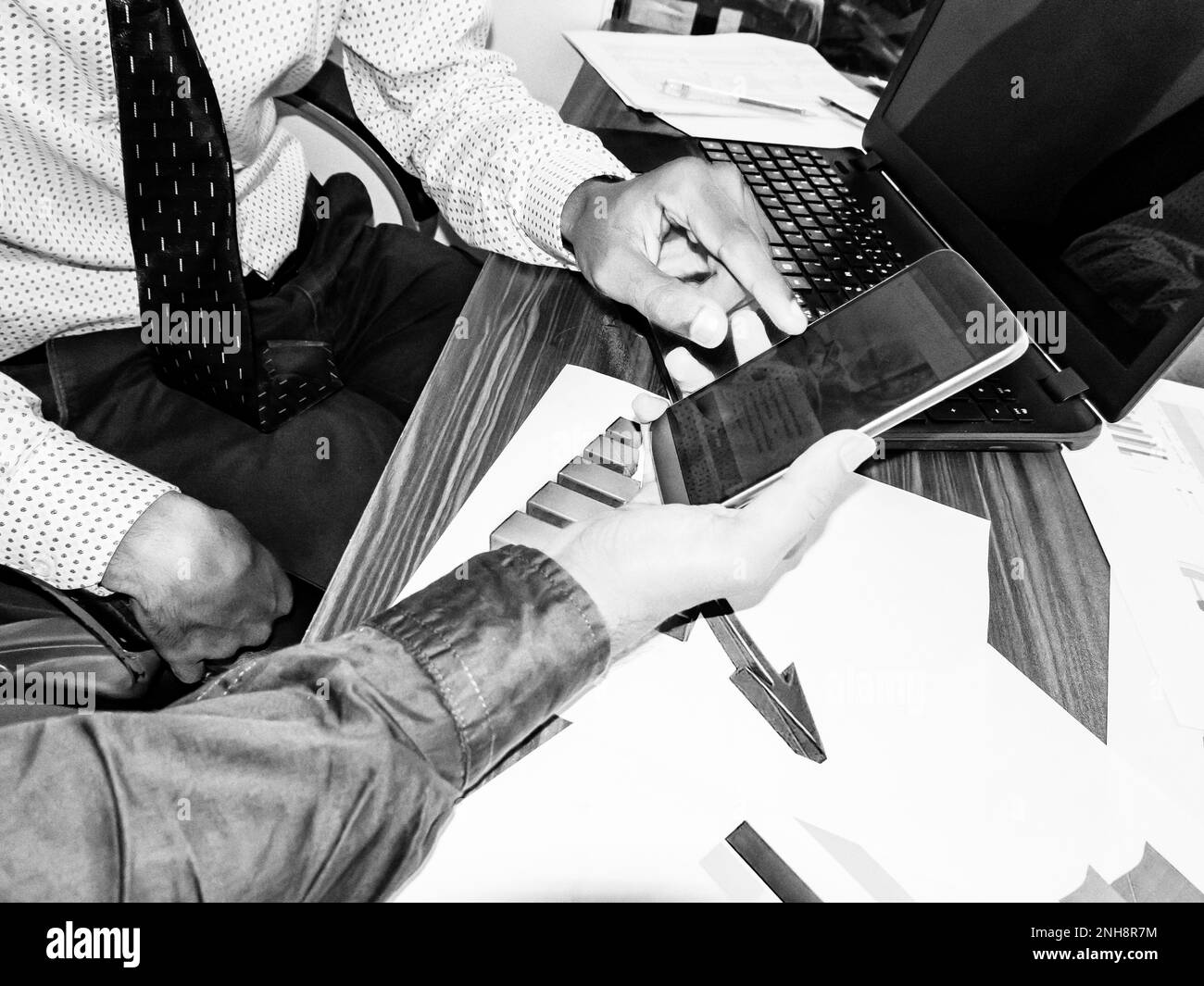 Two business young indian adults men with smartphone and laptop working