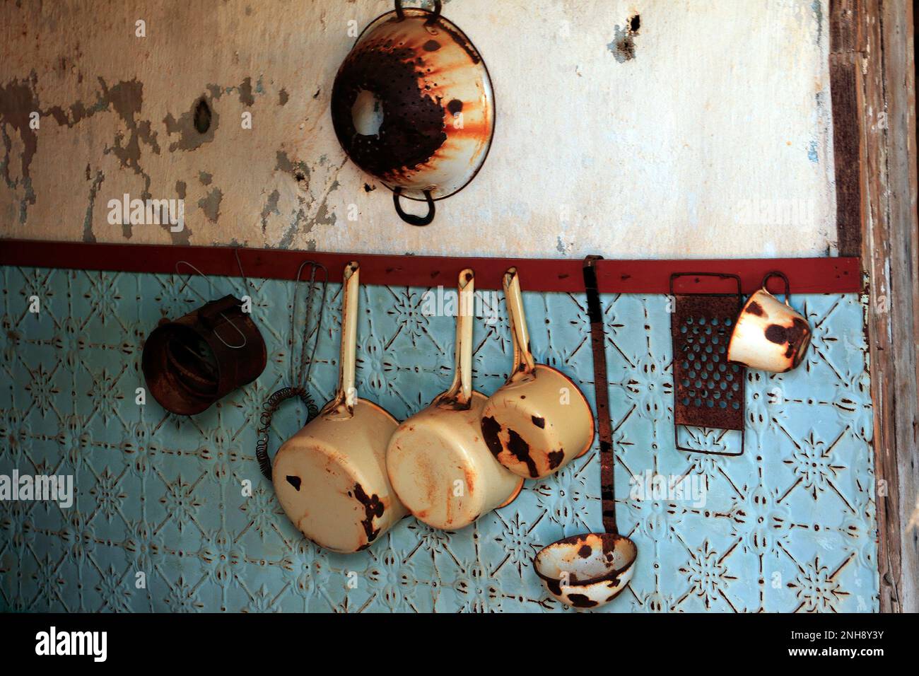 Pots and kitchen ware hanging on a wall, Gwalia, historical gold mining