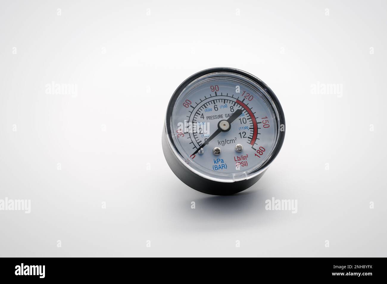 Small pressure gauge. Closeup. On white background Stock Photo Alamy
