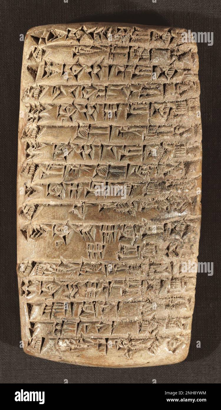 Sumerian accounting tablet written in cuneiform script, dating from between 2200 BC and 1900 BC. Some of it concerns the receipt of she-goats and lambs. Stock Photo