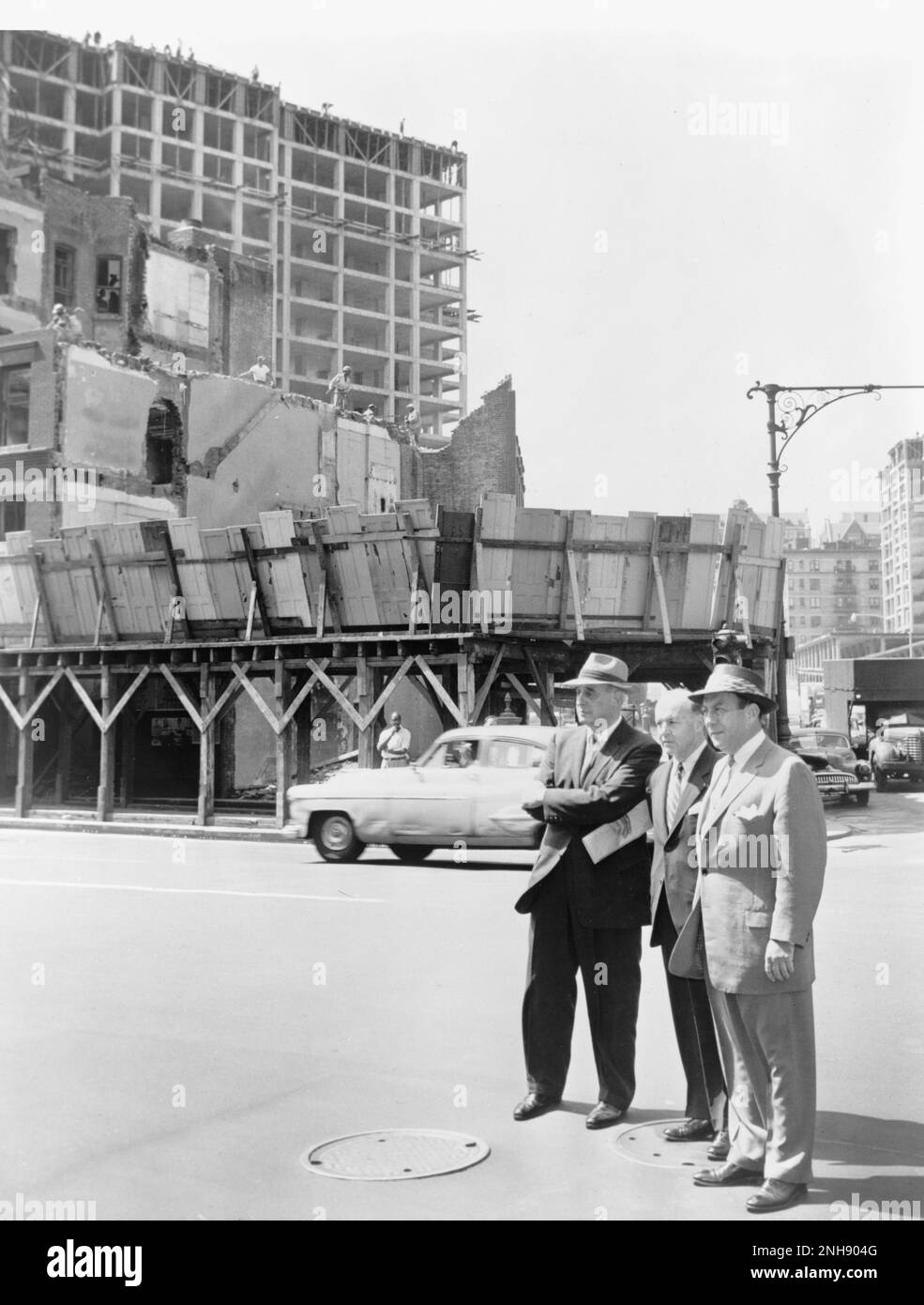 New York City Mayor Robert Wagner (r) joined by Robert Moses (l) and Frank Meistrell (c) on a housing project tour in New York City. Photographed by Walter Albertin, August 9th, 1956. Stock Photo
