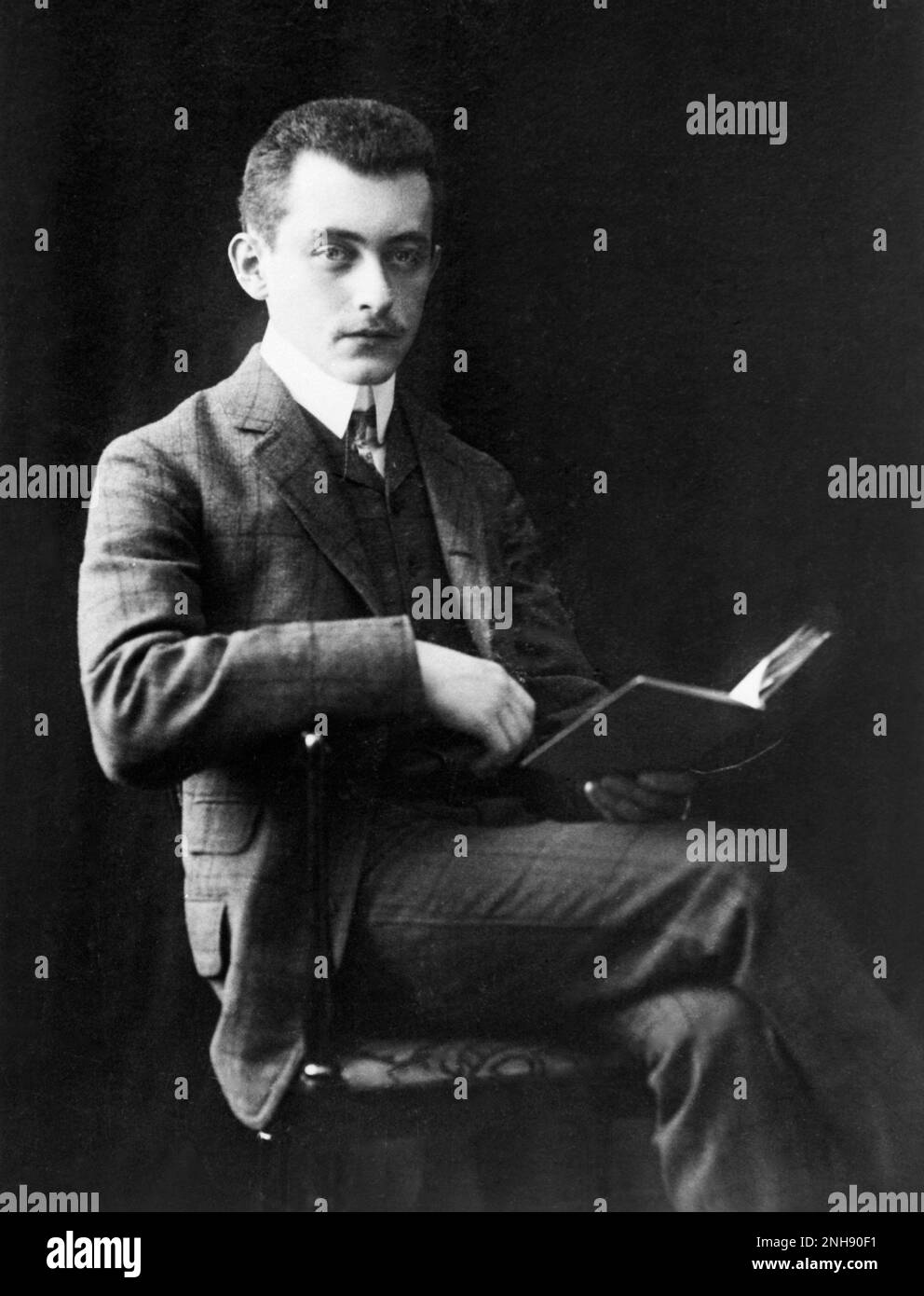 Portrait of Max Born reading, c. early 20th century. Born (1882-1970) was a German physicist and mathematician who was instrumental in the development of quantum mechanics. He won the 1954 Nobel Prize in Physics. Stock Photo