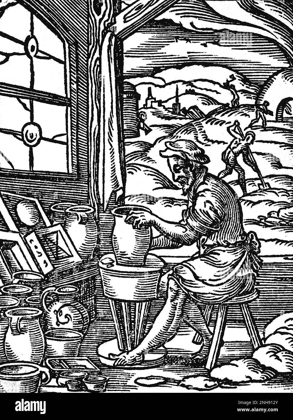 A potter making clay pots on a wheel. Illustration from Jost Amman's Book of Trades, 1568. Stock Photo