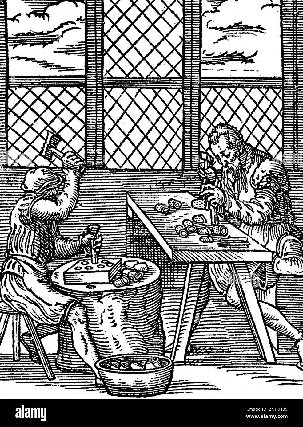 Two craftsmen making thimbles. Illustration from Jost Amman's Book of Trades, 1568. Stock Photo