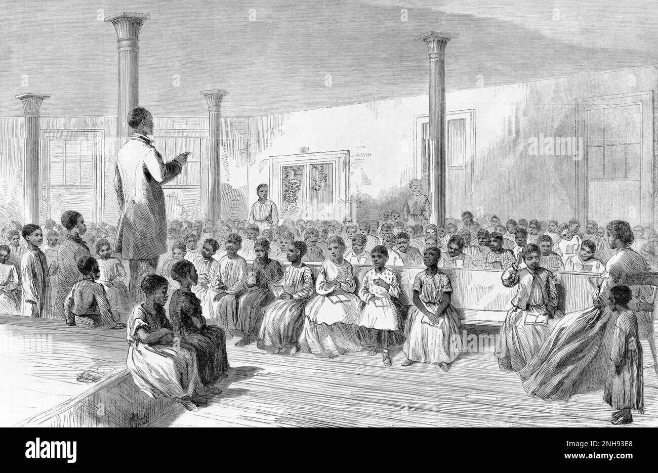 A school for freed black children in Charleston, South Carolina. Before the Civil War, it was illegal to teach slaves to read. Illustration by Alfred R. Waud, Harper's Weekly, December 15, 1866. Stock Photo
