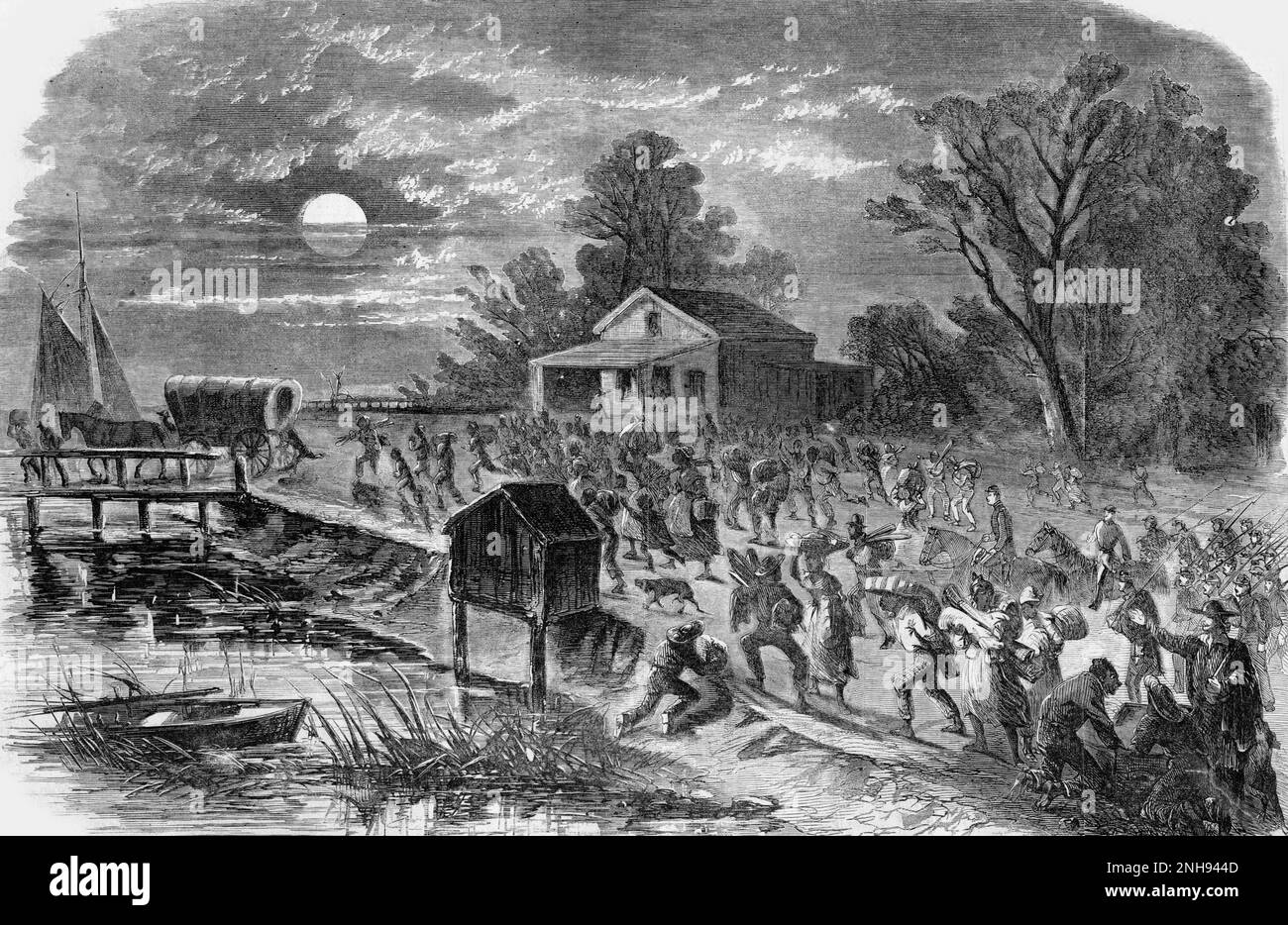 Fugitive slaves carrying their possessions and running along a river bank at night toward a bridge leading from Hampton, Virginia, to Fort Monroe, during the Civil War. There are some Union soldiers among them. Illustration from Harper's Weekly, August 17, 1861. Stock Photo