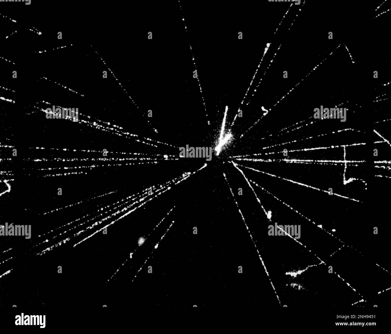 A proton-antiproton interaction at 540 GeV, showing particle tracks in a streamer chamber. The dark bands on each side are lead baffles, designed to generate cascades as particles pass through. Photo taken in 1982 at CERN‚Äôs Super Proton Synchrotron by the UA5 collaboration. Stock Photo