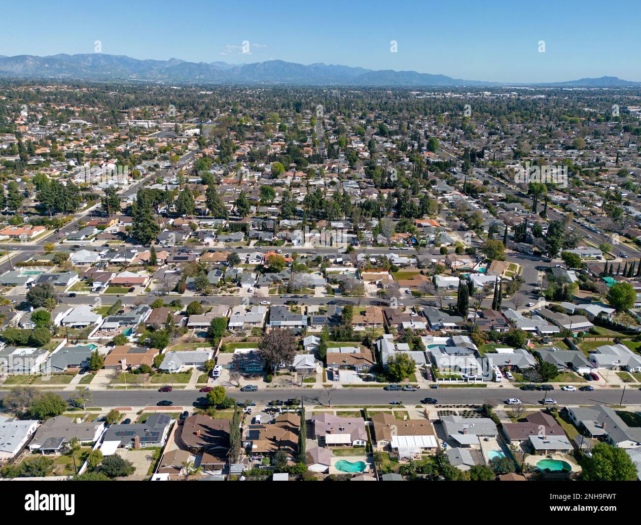The San Fernando Valley, located in northern section of greater Los Angeles, California is shown from an aerial view during an afternoon day. Stock Photo