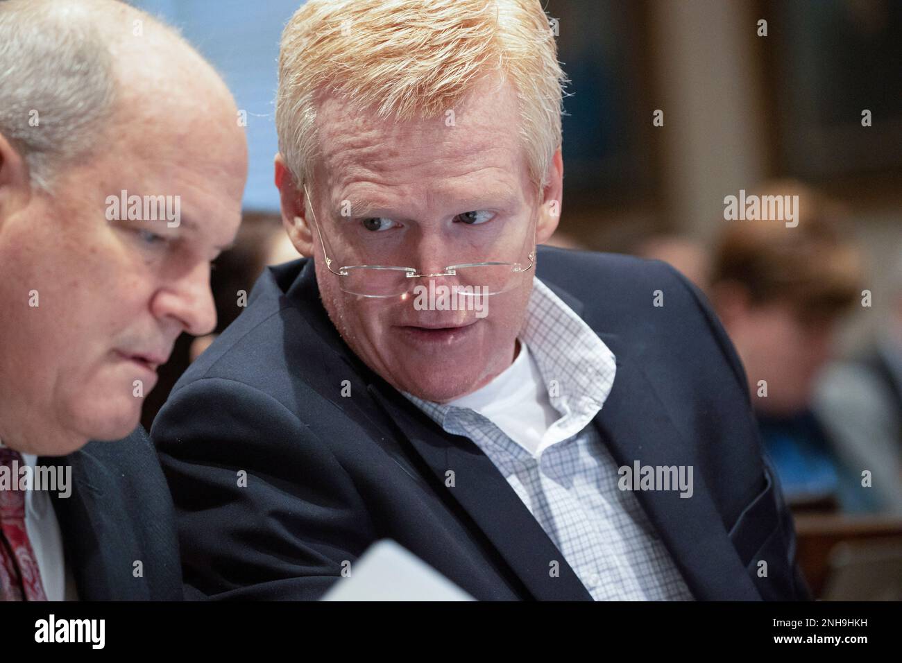 Alex Murdaugh, right, leans over to talk with his attorney Jim Griffin