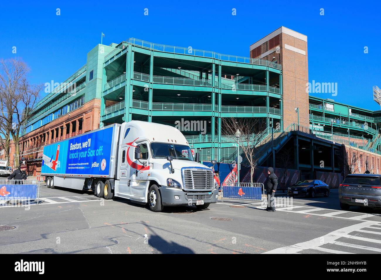 BOSTON, MA - FEBRUARY 03: Boston Red Sox mascots, Tessie the Green Monster  (left) and Wally the Green Monster (right), and Fenway Park Ambassadors,  toss soft baseballs to fans while on a