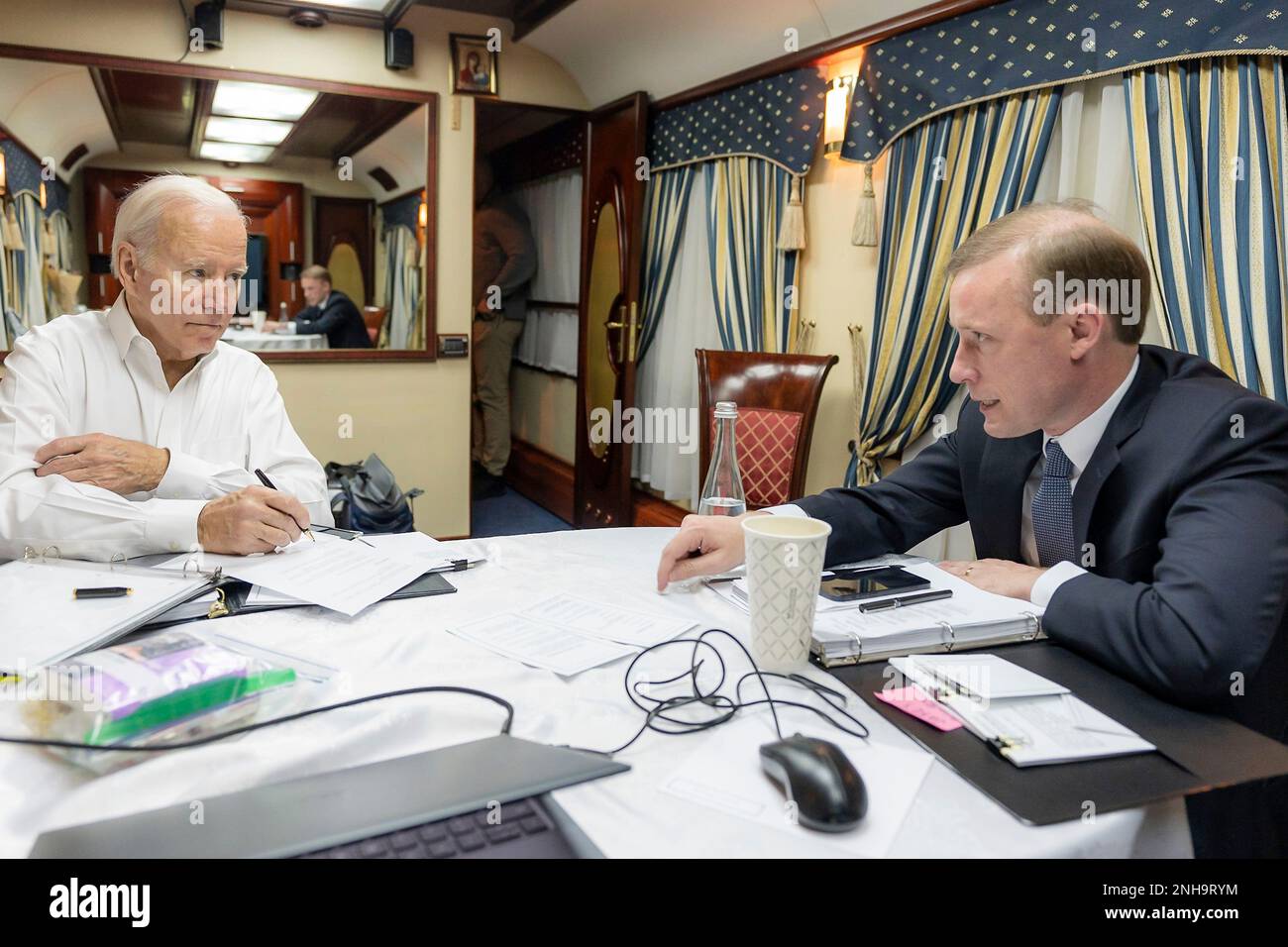 Przemysl, Poland. 19th Feb, 2023. U.S. President Joe Biden, left, listens to National Security Advisor Jake Sullivan during a briefing aboard a special train car departing Przemysl Glowing train station, February 19, 2023 in Przemysl, Poland. Biden departed Washington at 4:15am to Germany and then on to Poland before board a train to Kiev on an unannounced visit to renew American support for Ukraine. Credit: Adam Schultz/White House Photo/Alamy Live News Stock Photo
