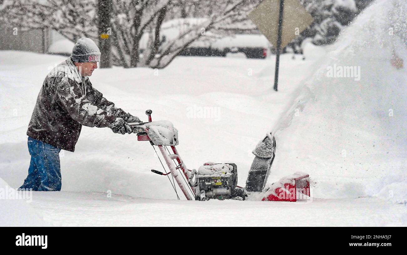 Darrell Chesley clears the snow from his driveway Sunday, Jan. 29, 2023
