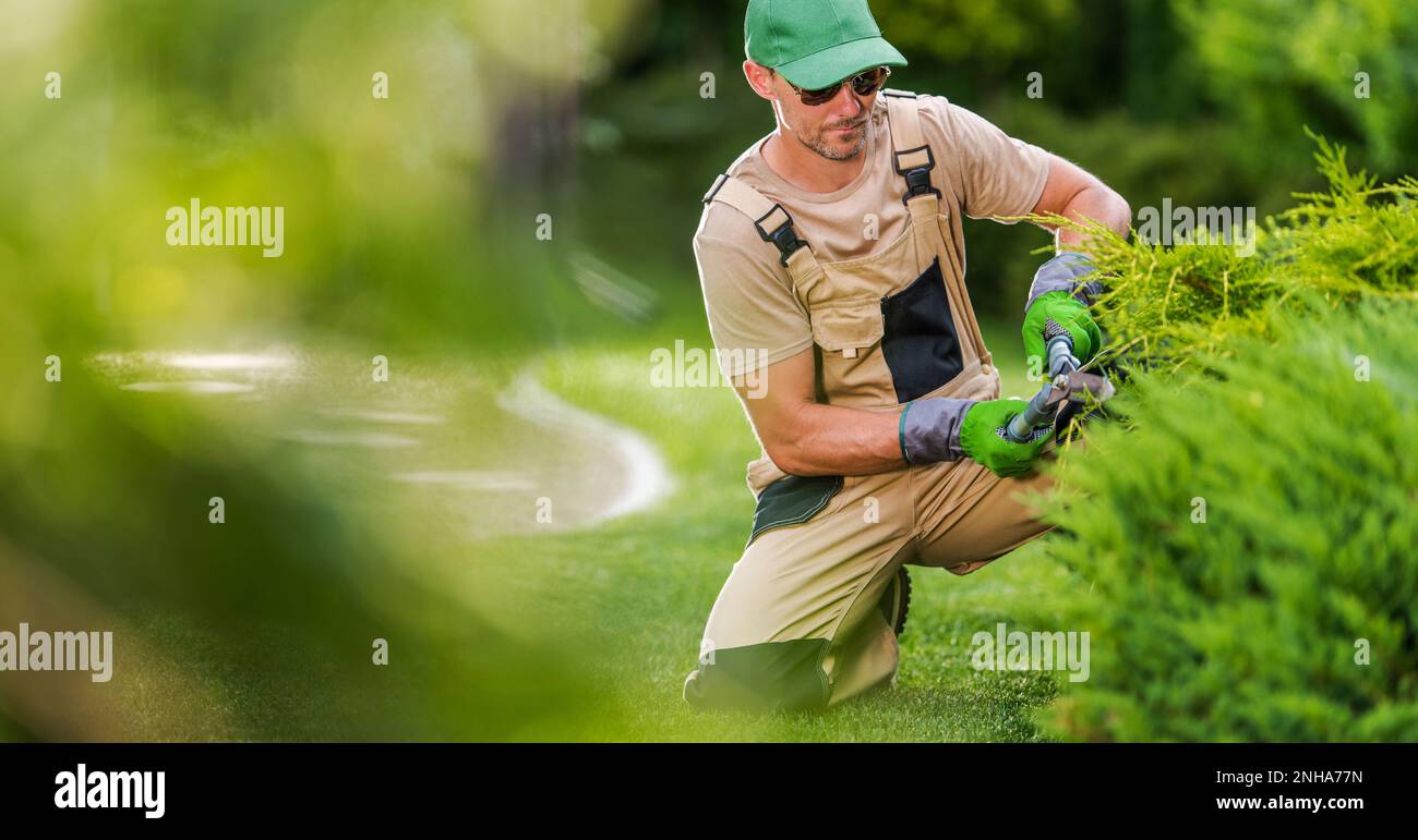 Professional Gardener Contractor in His 40s with Hedge Shears
